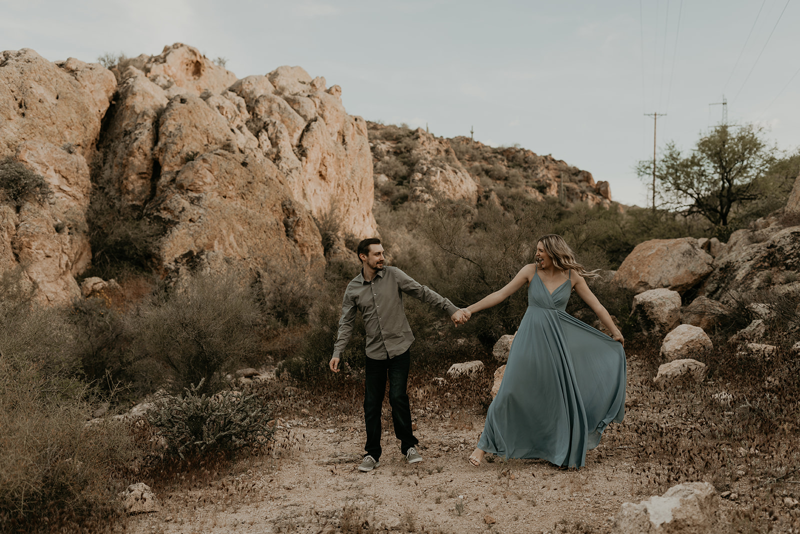 couple pose together during their Arizona engagement photo session