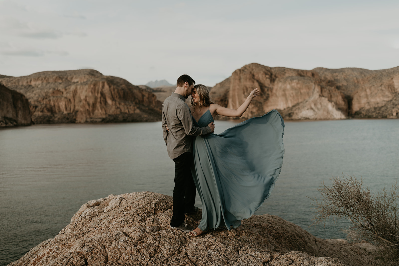 stunning couple pose together in Arizona during their dreamy Canyon Lake engagement photoshoot