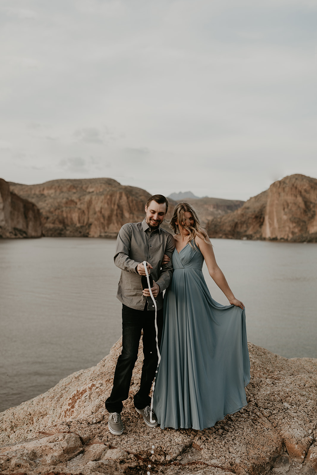 stunning couple pose together in Arizona during their dreamy Canyon Lake engagement photoshoot