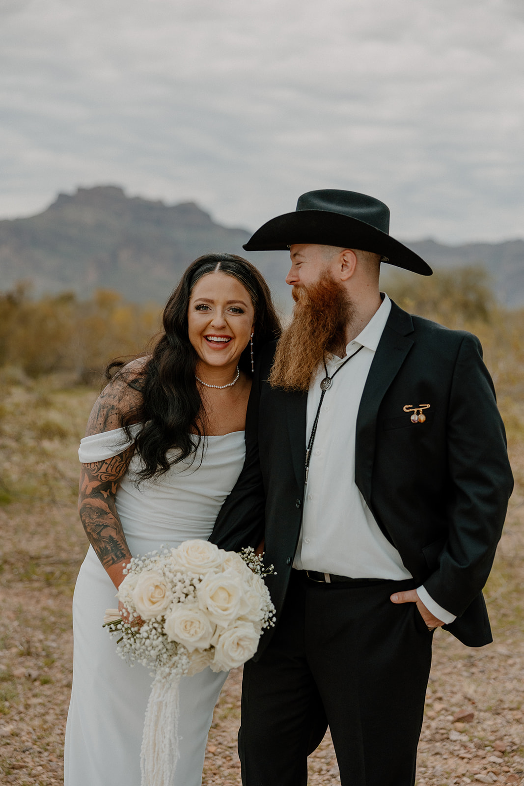 stunning bride and groom pose for a photo after their Apache Junction wedding ceremony