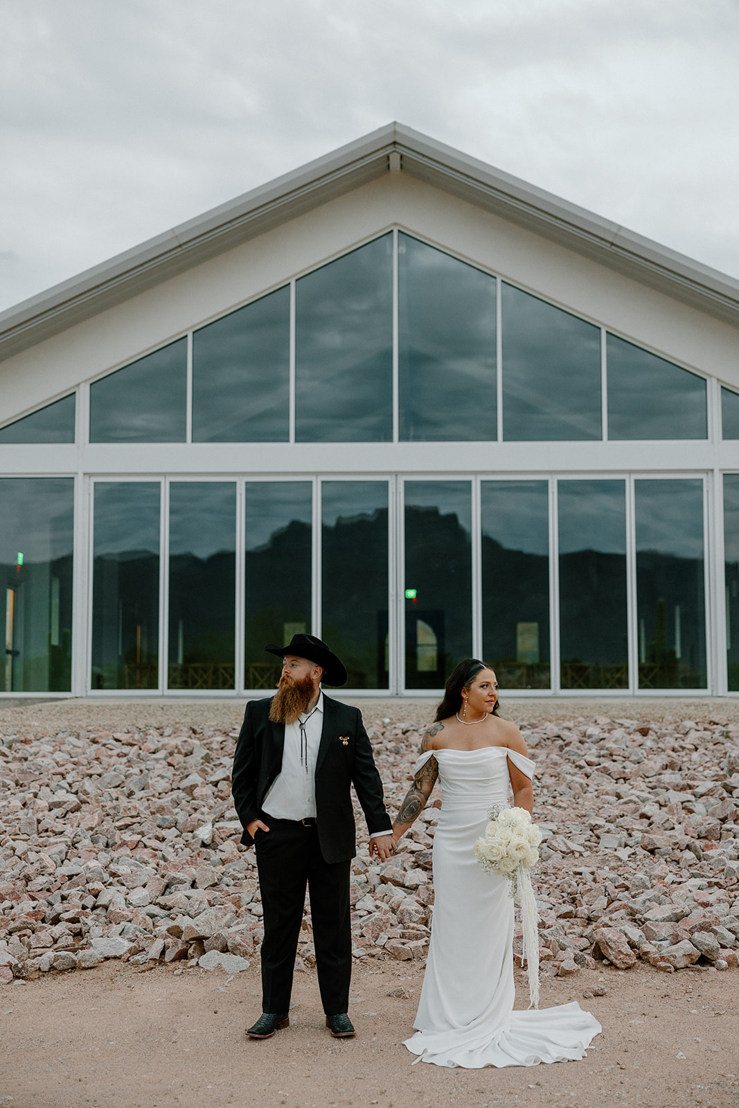 stunning bride and groom pose for a photo after their Apache Junction wedding ceremony