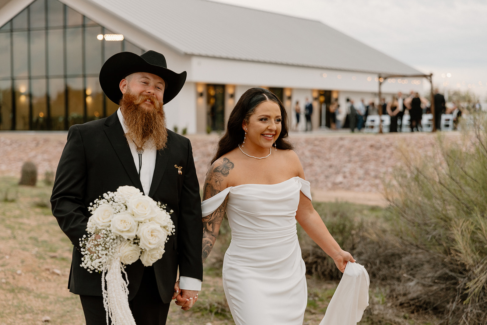 stunning bride and groom pose for a photo after their Apache Junction wedding ceremony