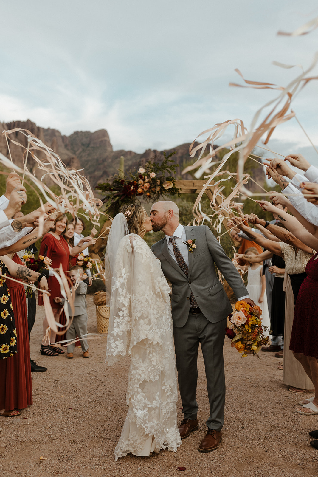 stunning bride and groom pose for a photo after their Apache Junction wedding ceremony