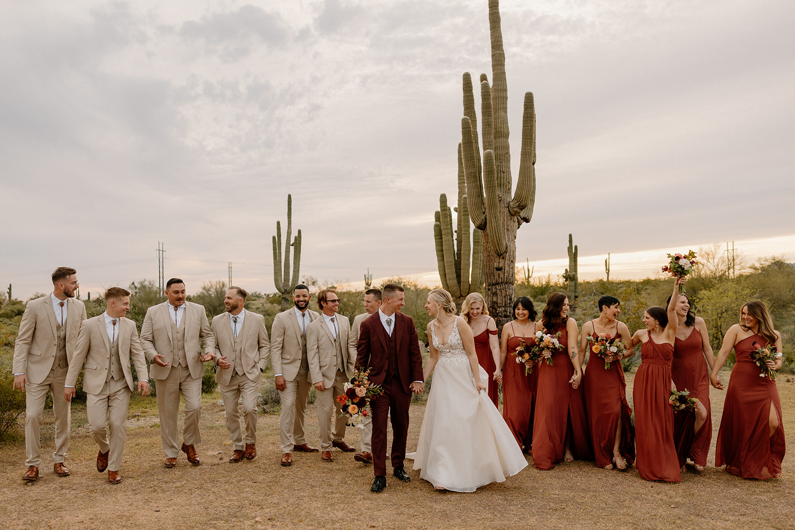 bride and groom pose with the wedding party after their dreamy wedding day