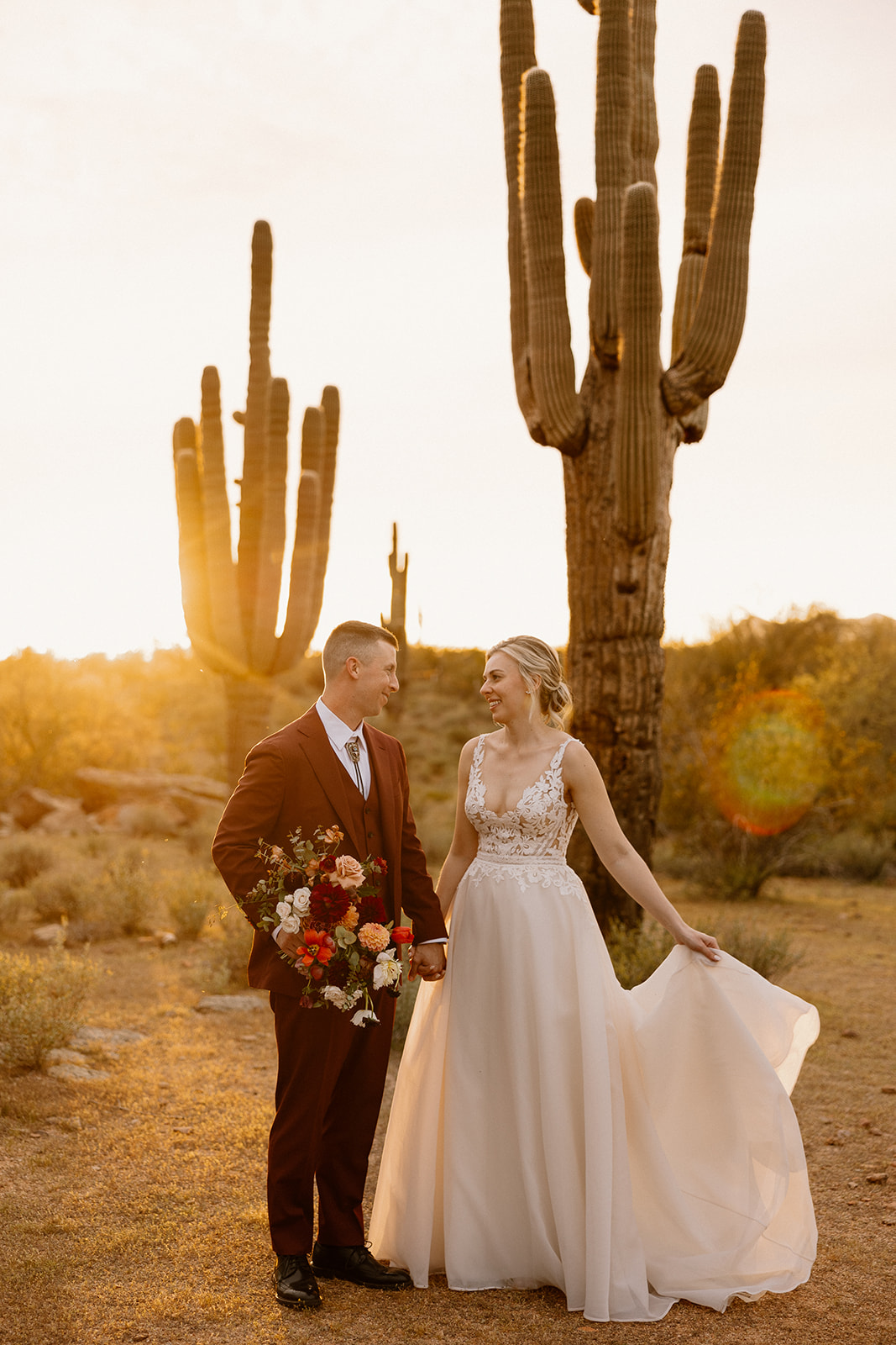 stunning bride and groom pose for a photo after their Apache Junction wedding ceremony