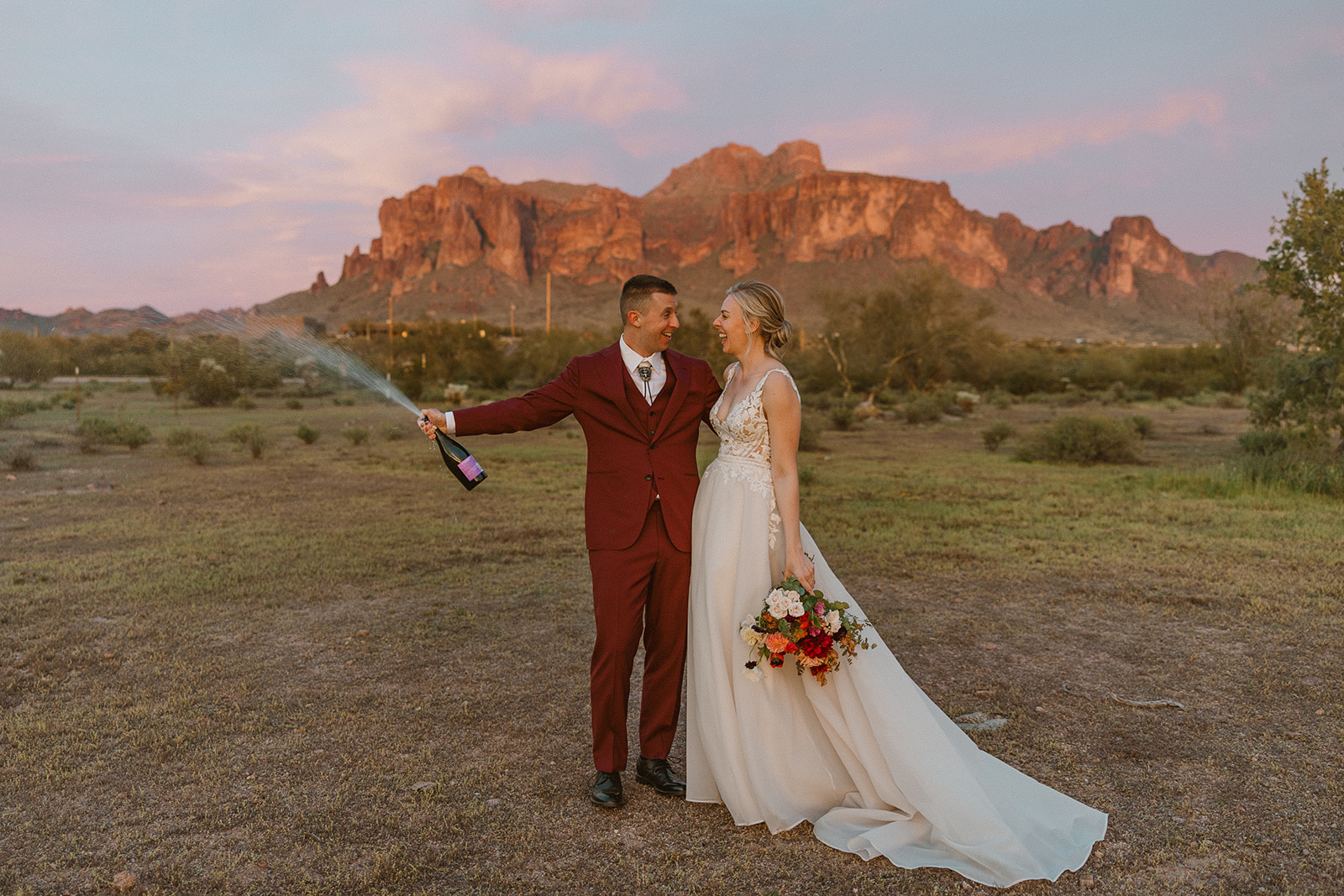 stunning bride and groom pose for a photo after their Apache Junction wedding ceremony