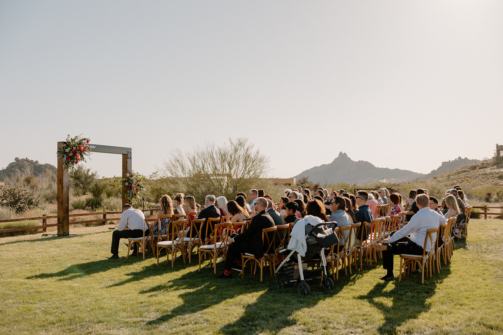 candid wedding photo of a beautiful backyard wedding ceremony