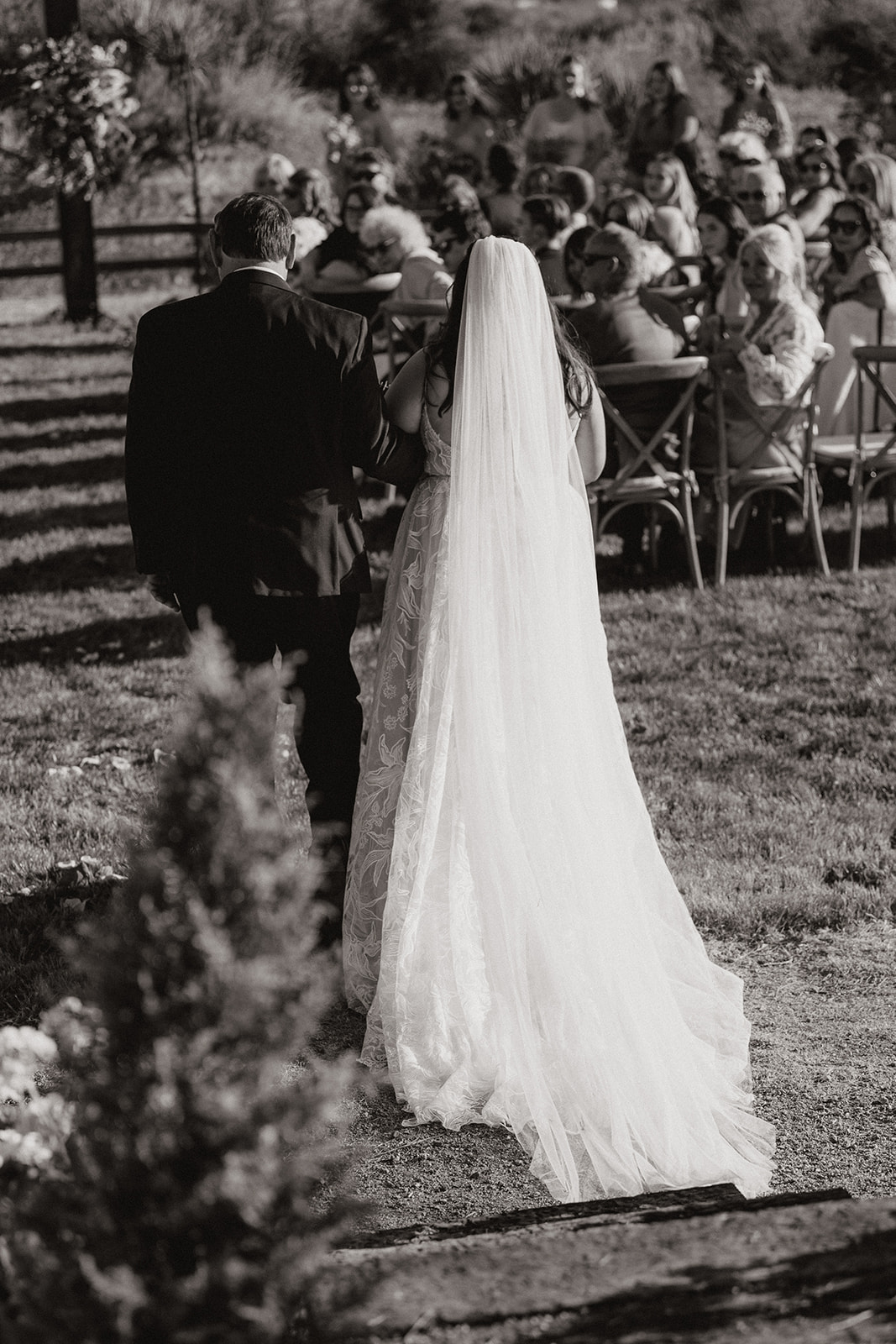 bride walks down the aisle with her dad 