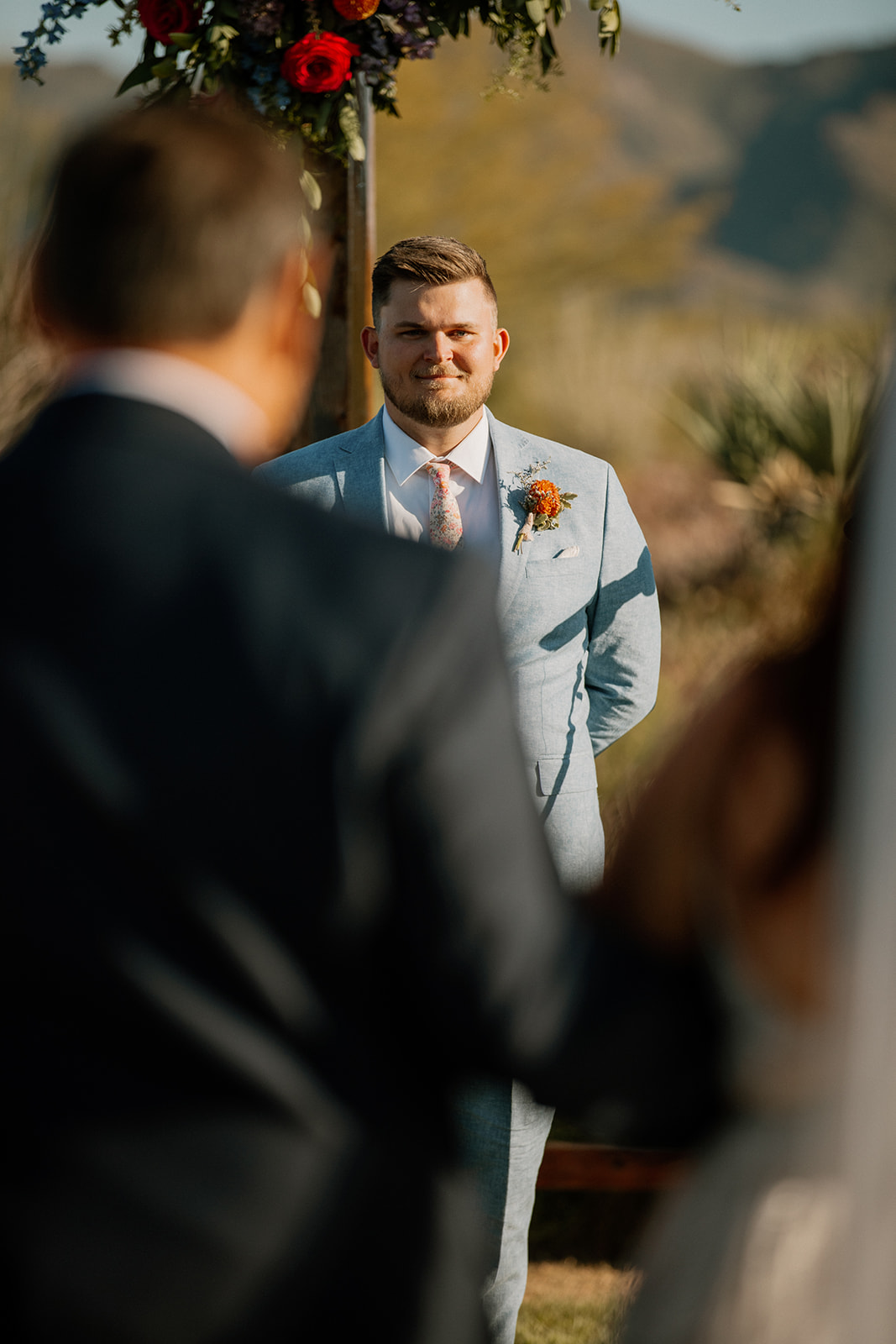 groom eagerly awaits as his bride approaches