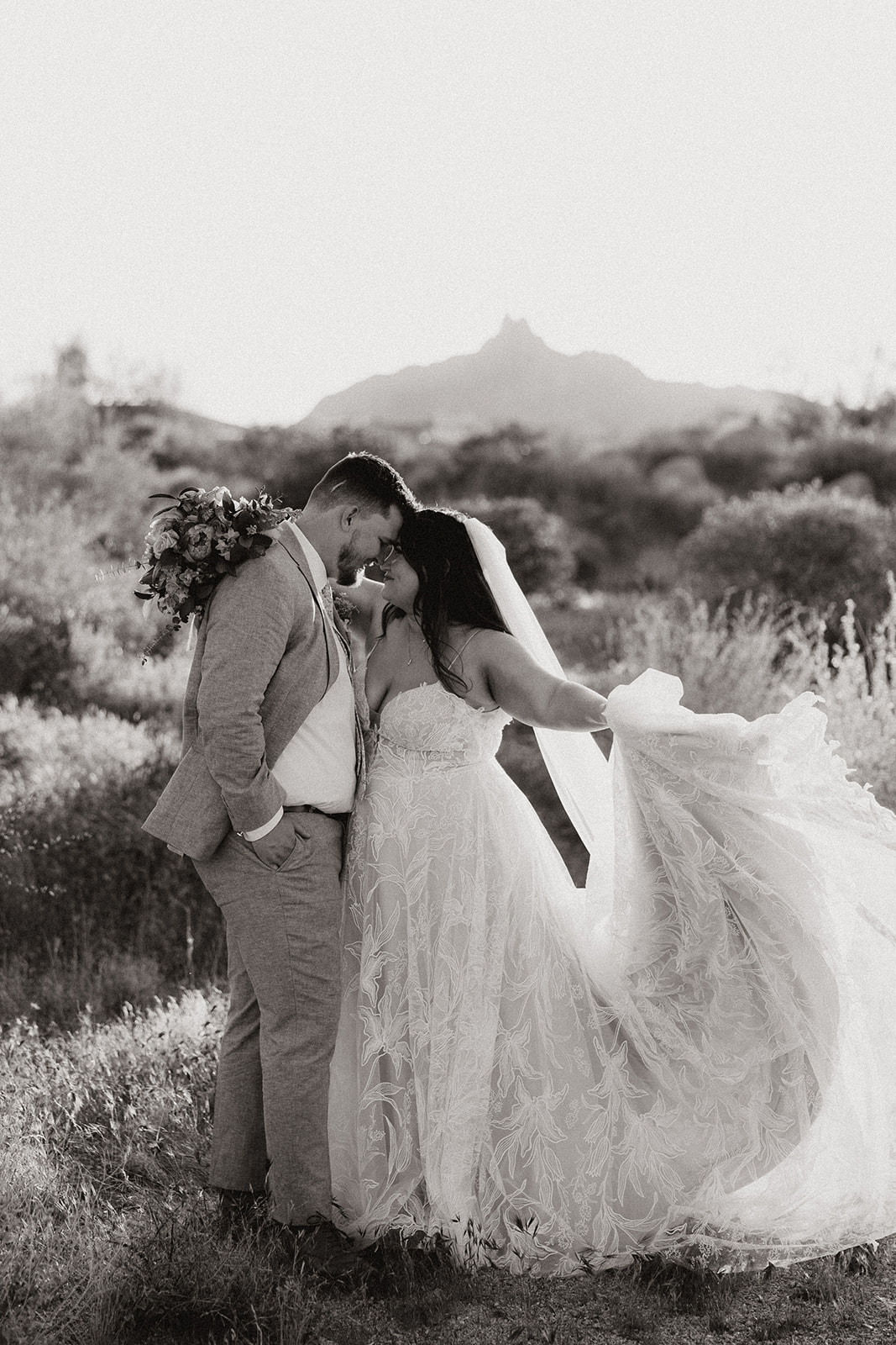 bride and groom pose in the beautiful Arizona desert