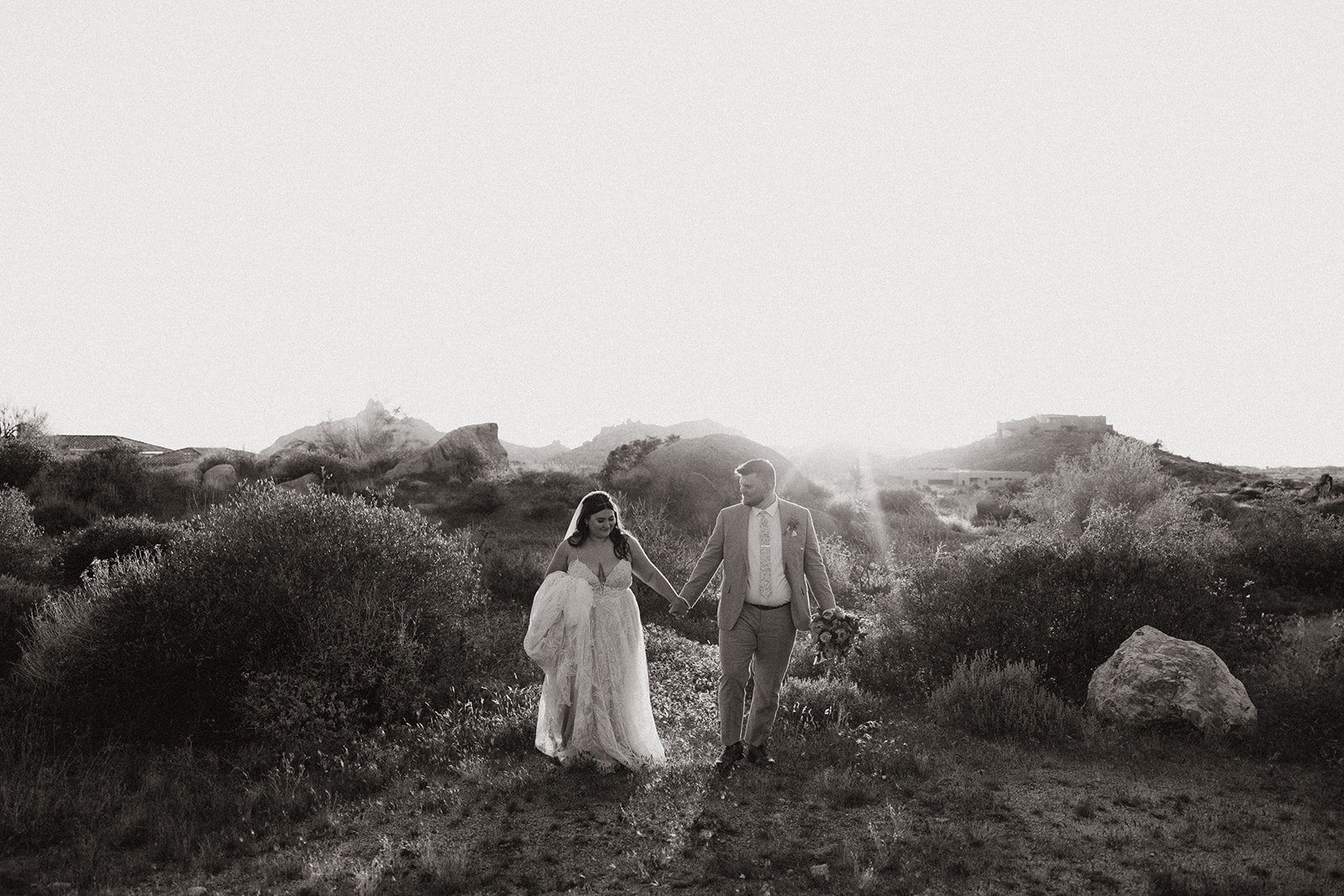 bride and groom pose in the beautiful Arizona desert