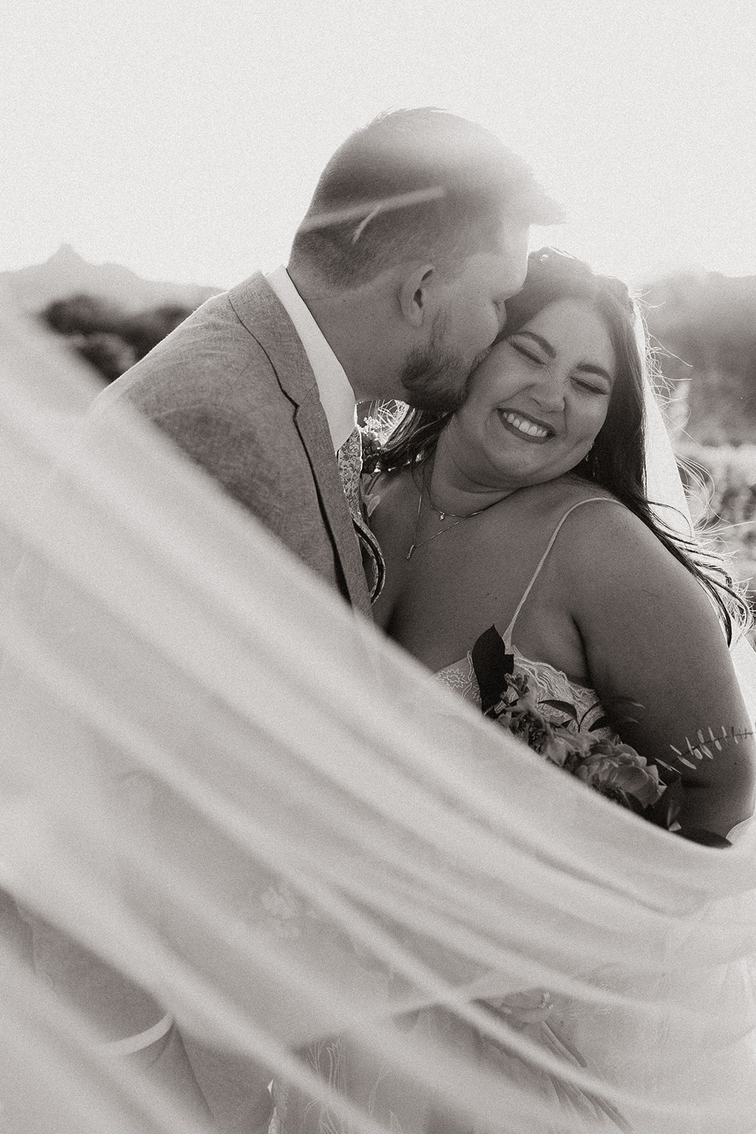 bride and groom pose in the beautiful Arizona desert