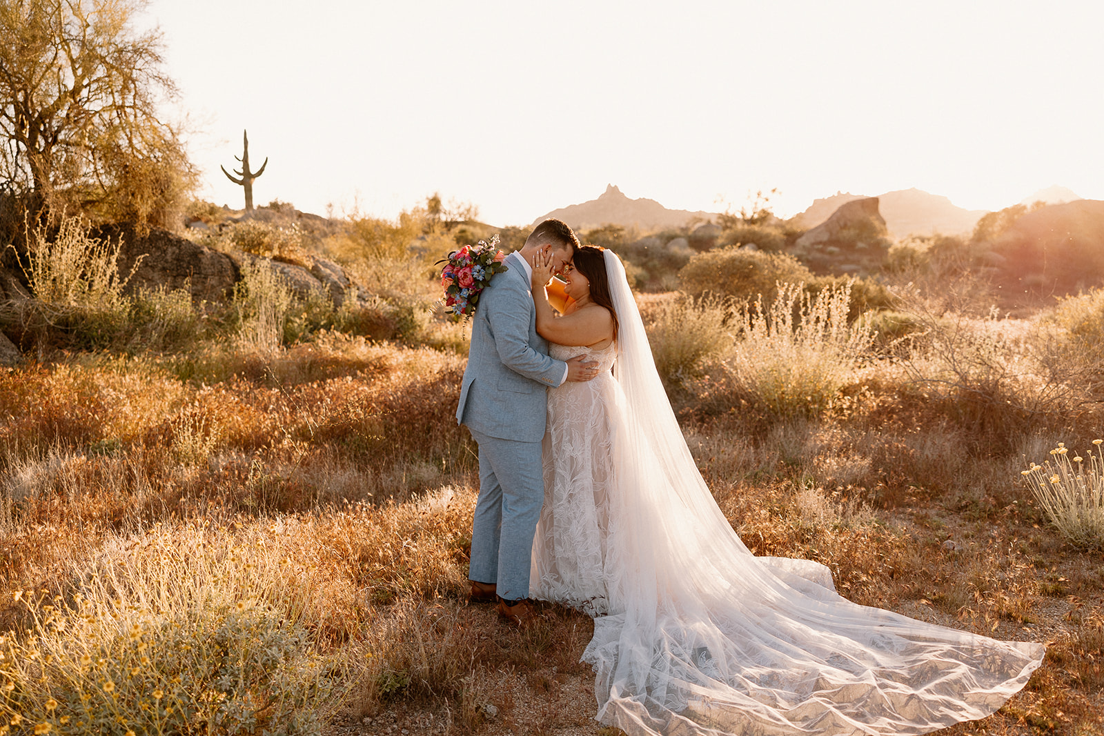 bride and groom pose during golden hour in the beautiful Arizona nature