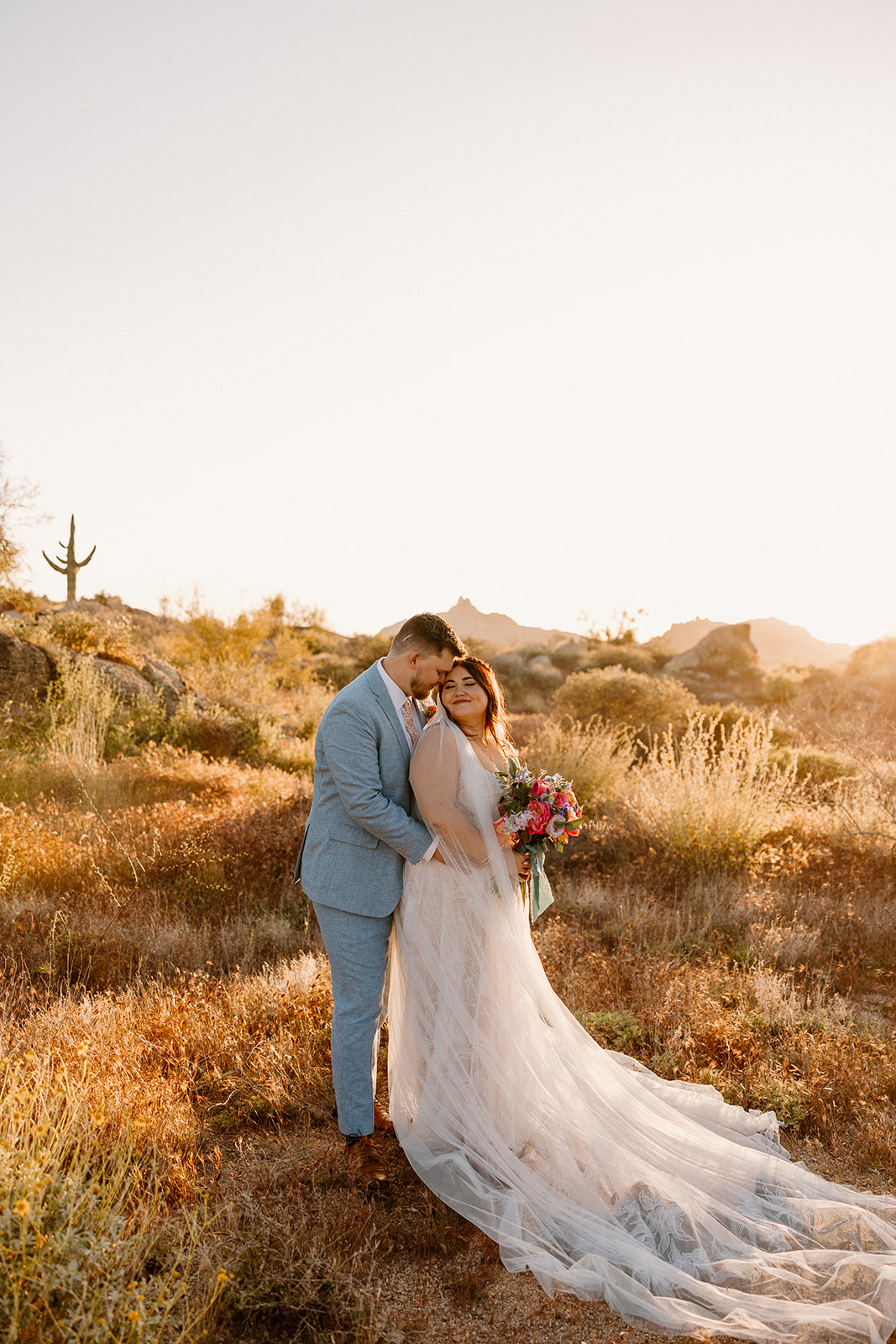 bride and groom pose in the beautiful Arizona desert