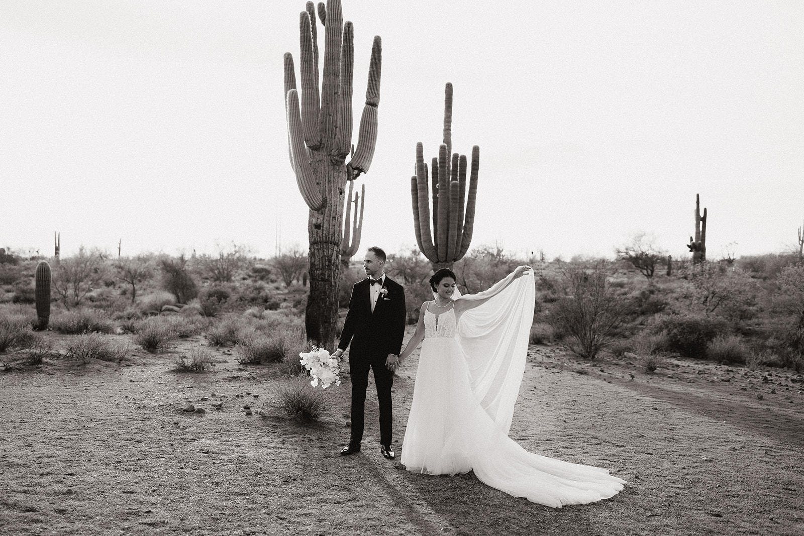 stunning bride and groom pose for a photo after their Apache Junction wedding ceremony