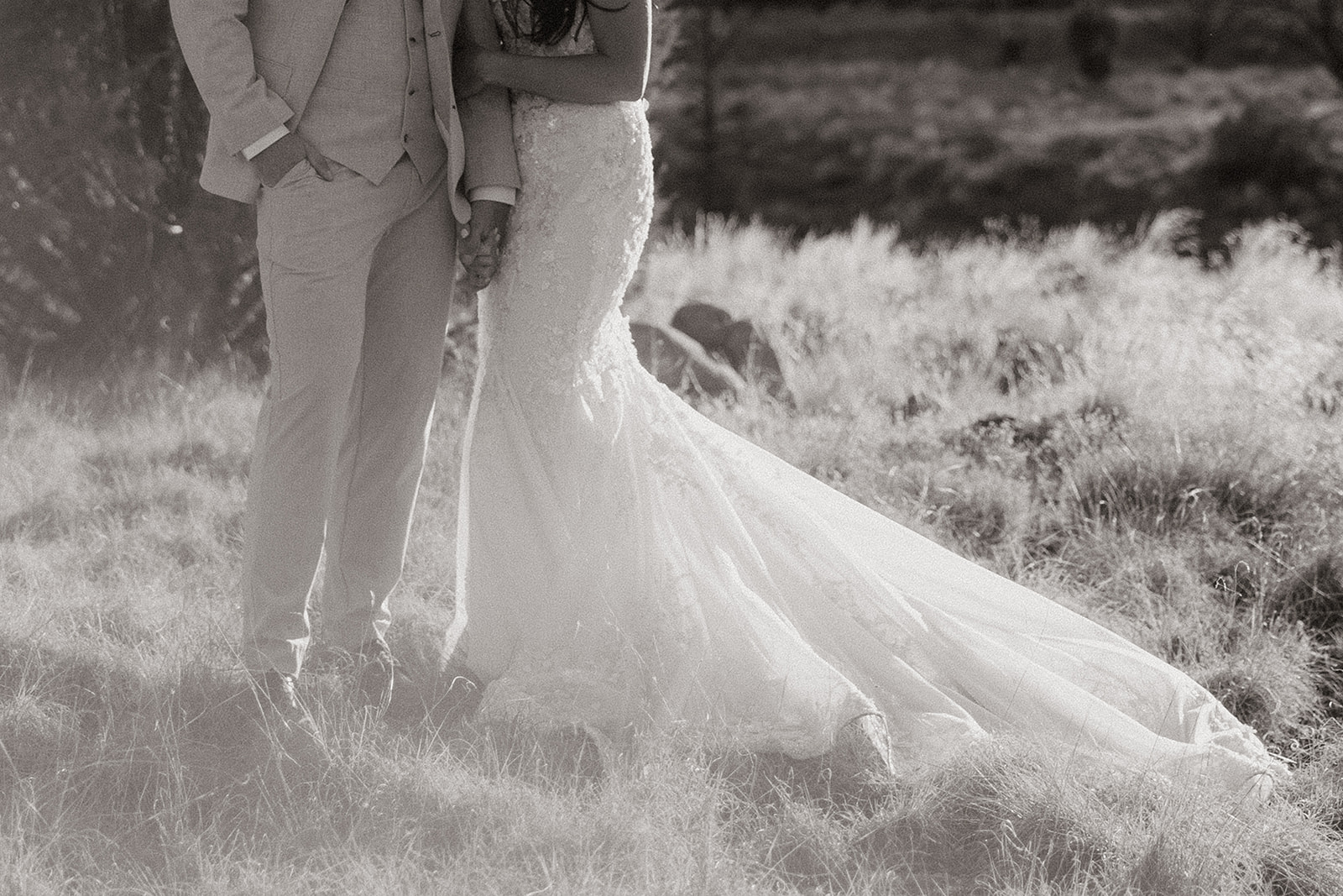 bride and groom pose together in the Arizona desert during their post wedding photoshoot