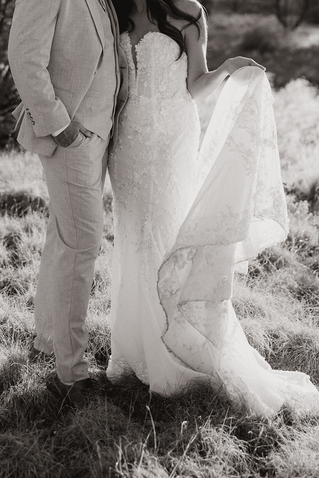 bride and groom pose together in the Arizona desert during their post wedding photoshoot