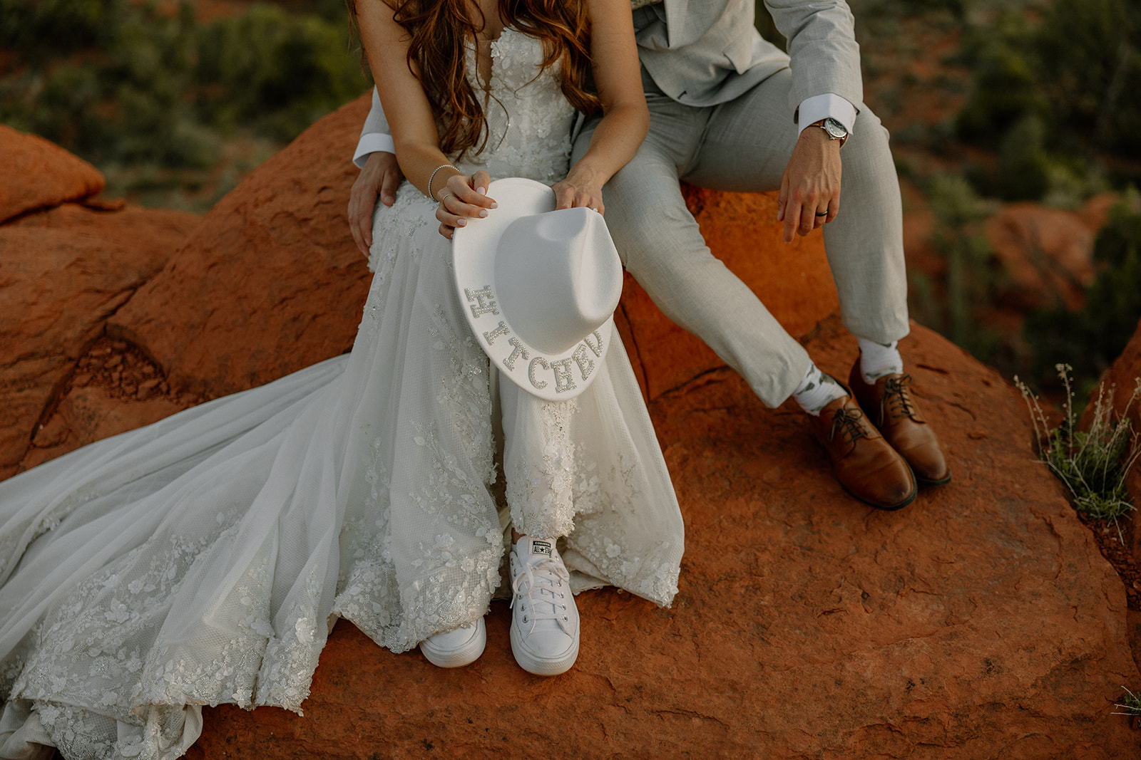 bride and groom pose together in the Arizona desert during their post wedding photoshoot