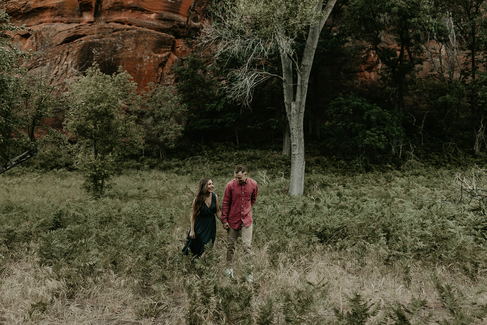 beautiful couple pose in the Arizona nature during their West Fork Trail engagement photoshoot