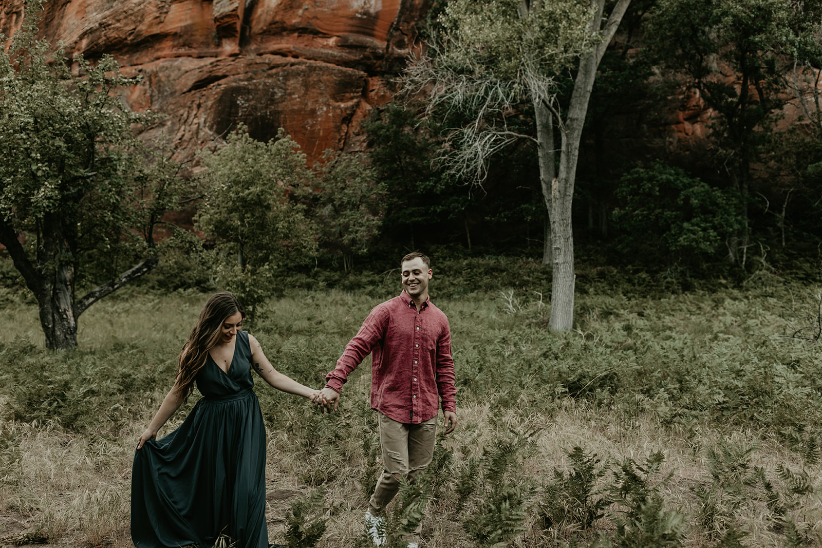 beautiful couple pose in the Arizona nature during their West Fork Trail engagement photoshoot