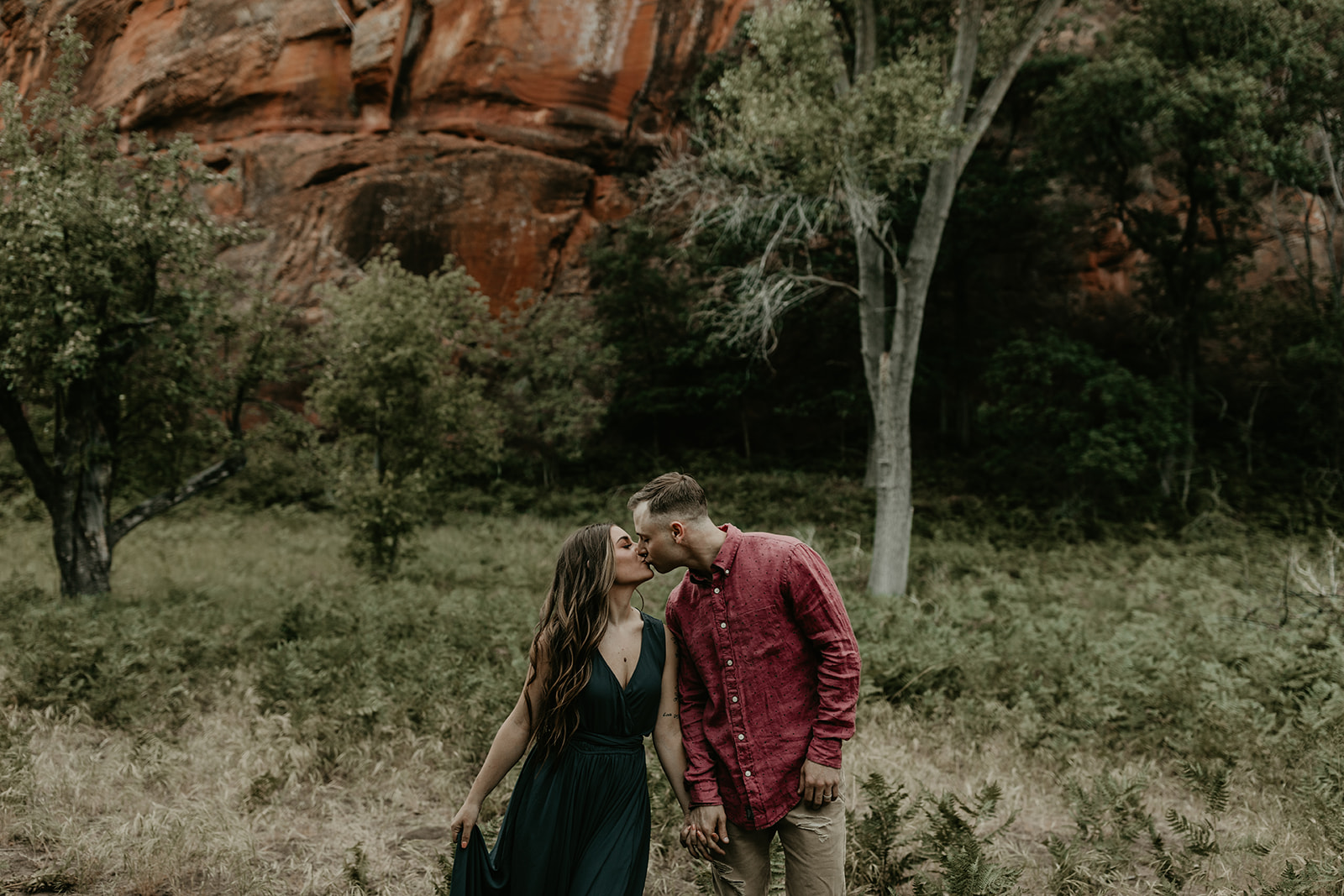 beautiful couple pose in the Arizona nature during their West Fork Trail engagement photoshoot