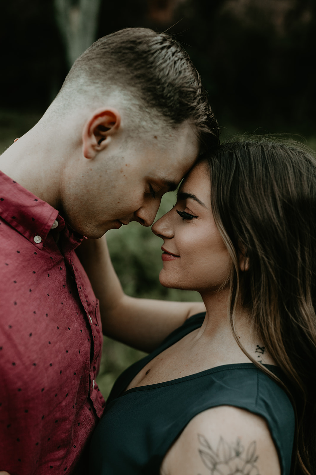 stunning couple share an intimate moment during their West Fork Trail Arizona engagement photo session