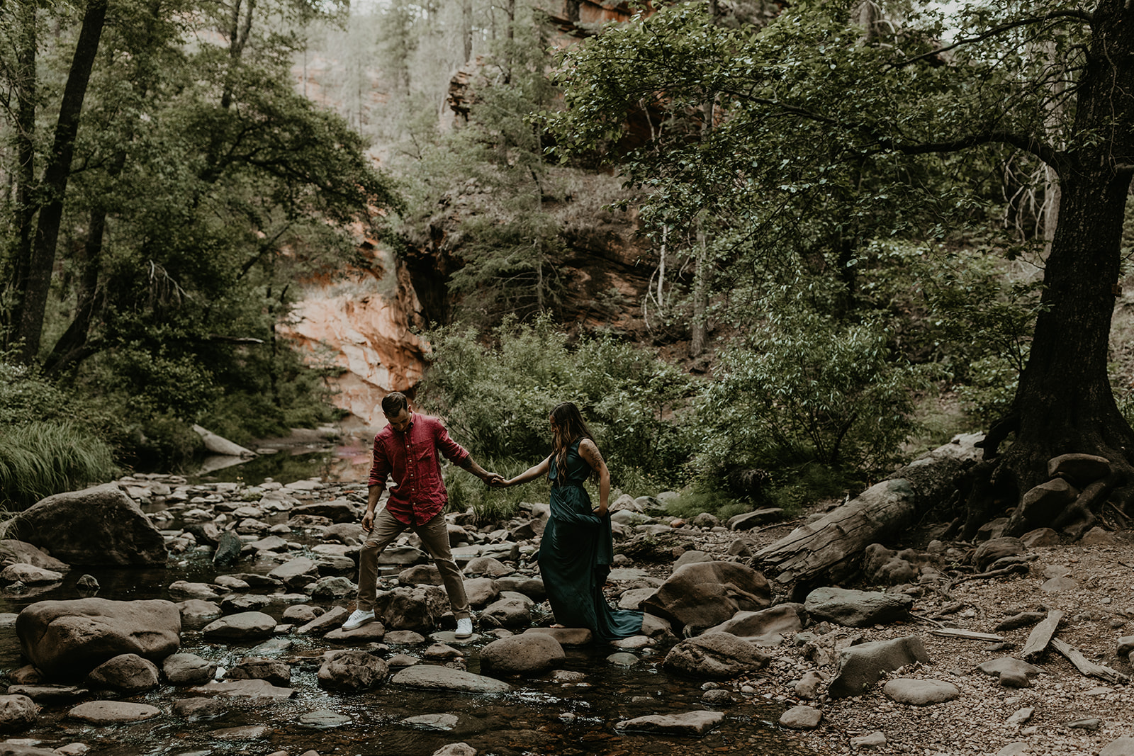 beautiful couple pose in the Arizona nature during their West Fork Trail engagement photoshoot