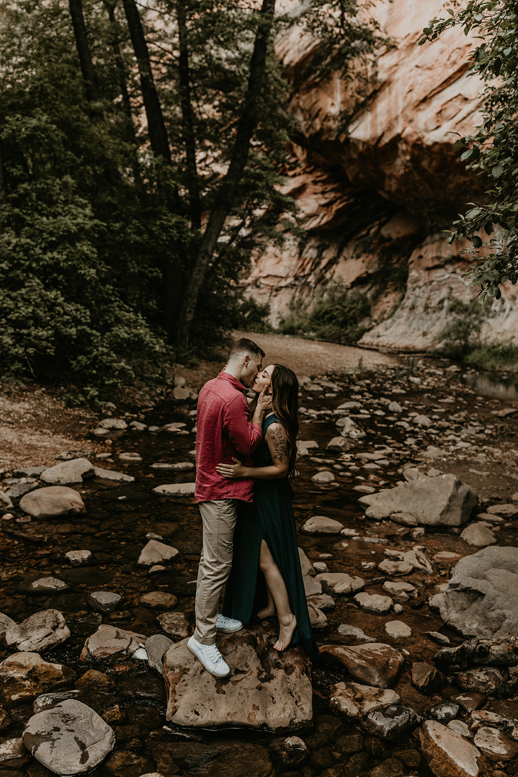 beautiful couple pose in the Arizona nature during their West Fork Trail engagement photoshoot