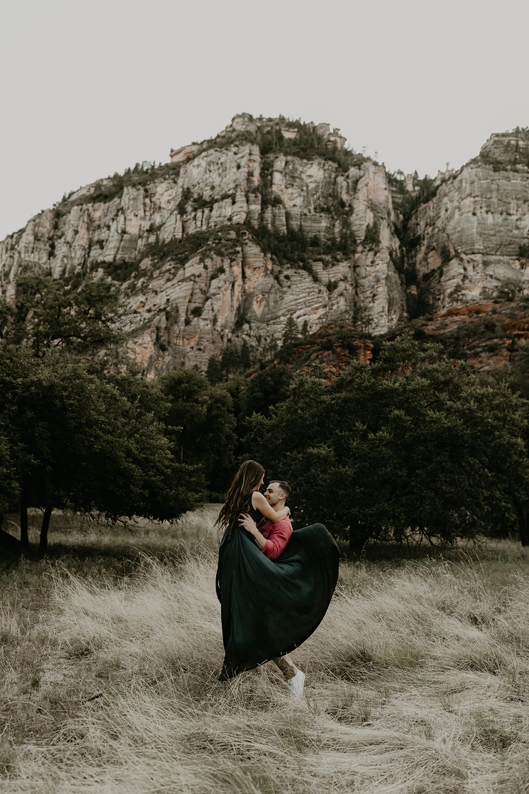 beautiful couple pose in the Arizona nature during their West Fork Trail engagement photoshoot