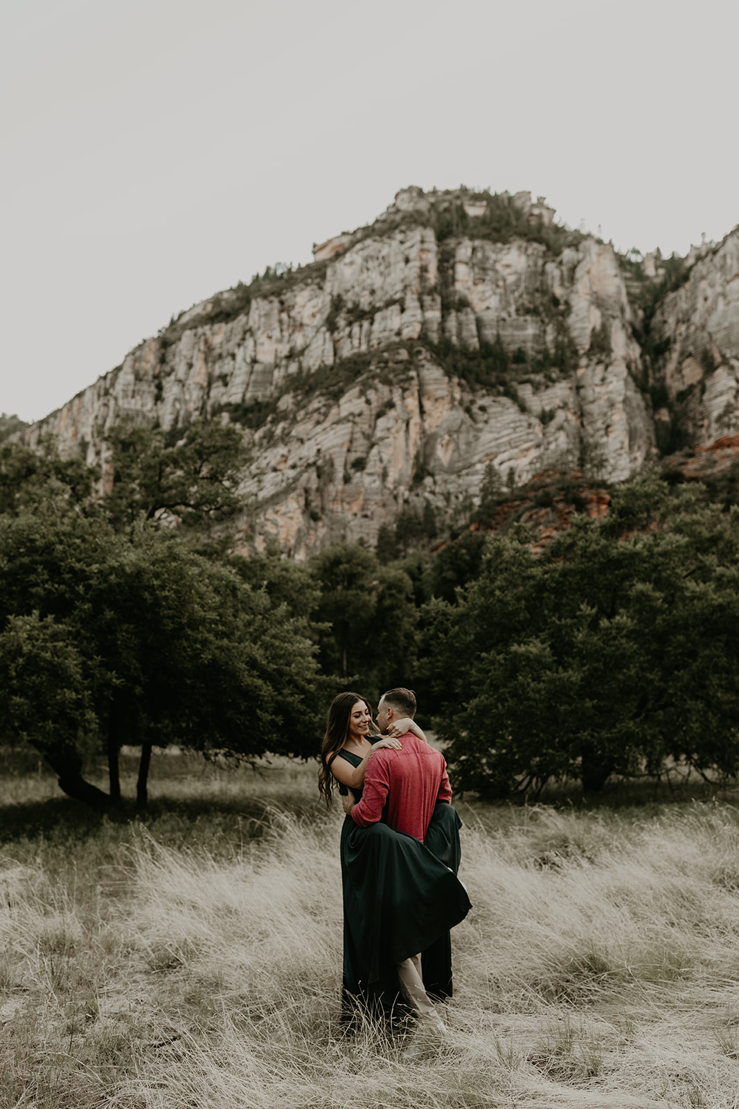 beautiful couple pose with the Arizona nature in the background