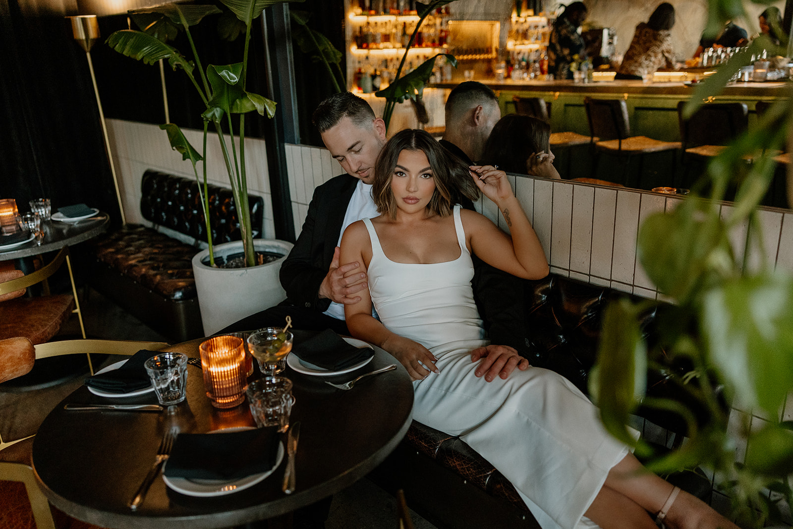 stunning couple share an intimate moment during their Arizona bar engagement photoshoot