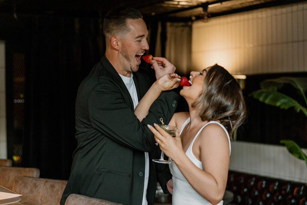 stunning couple share a candid laugh during their natural engagement photoshoot