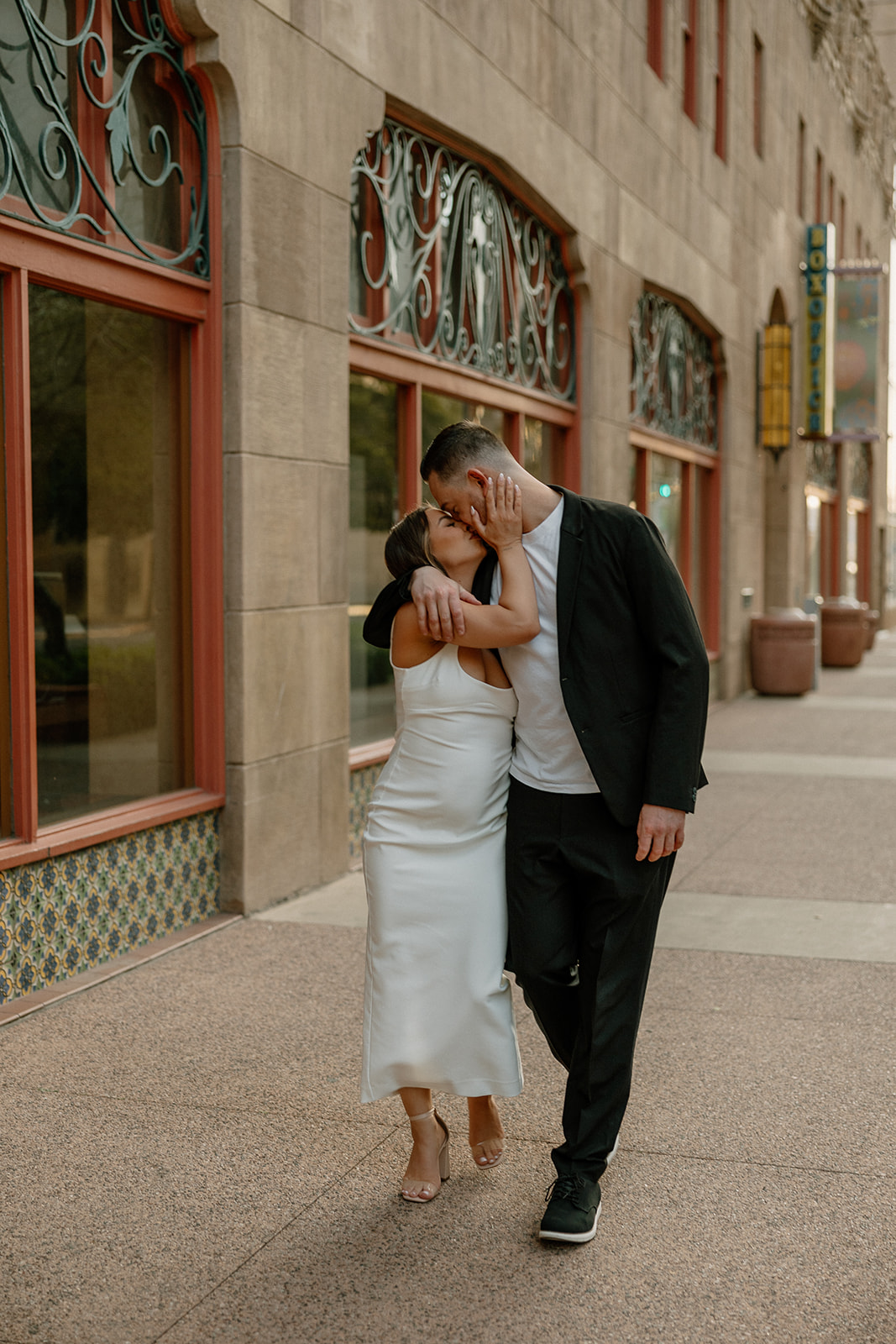 stunning couple share an intimate moment during their Arizona bar engagement photoshoot