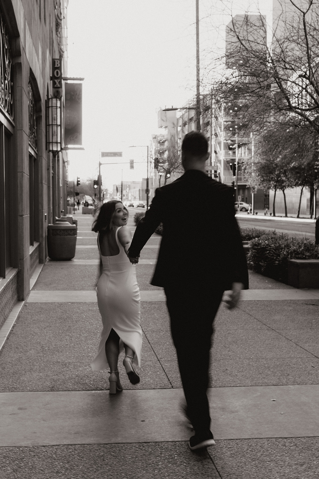 stunning couple share a candid laugh during their natural engagement photoshoot