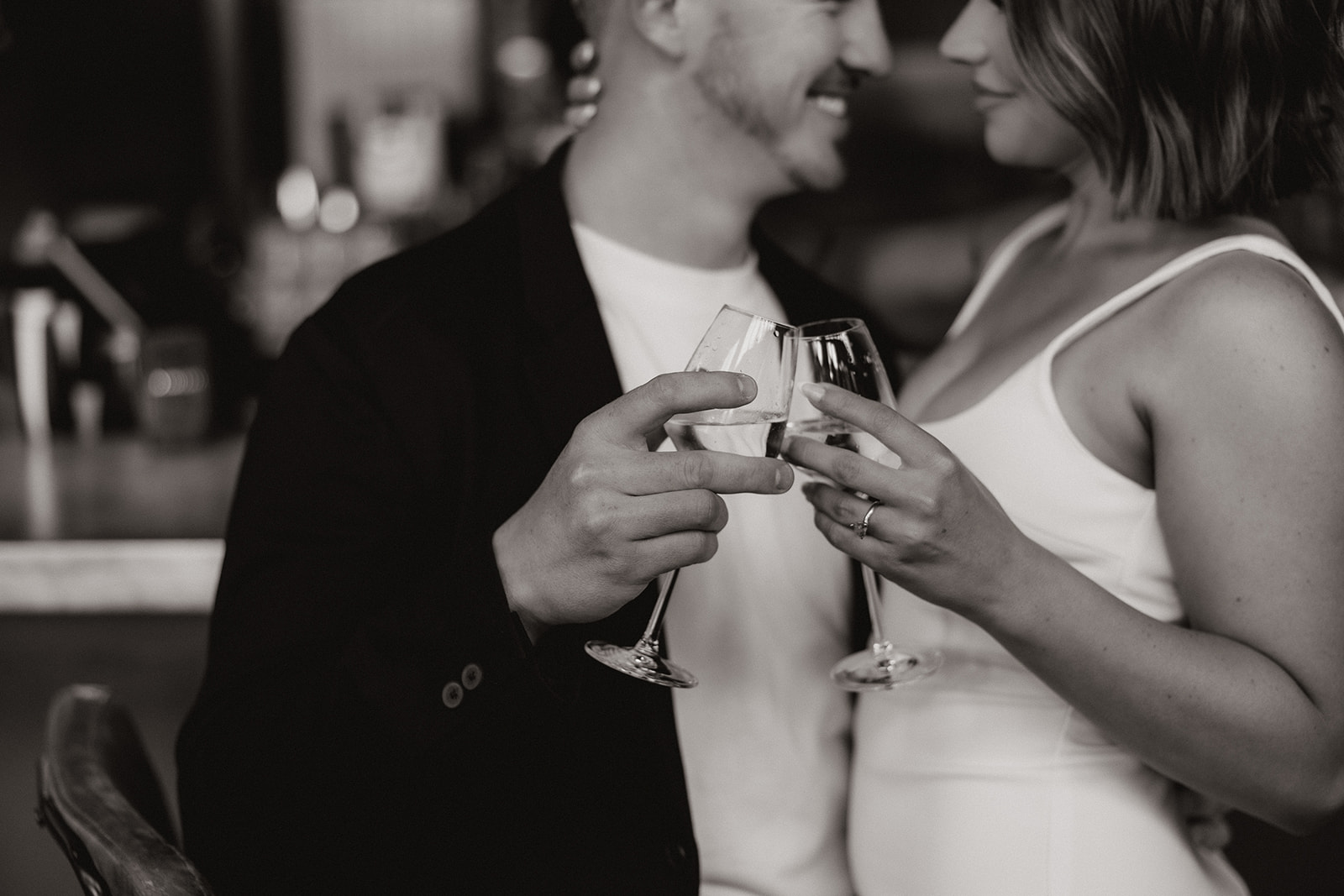 stunning couple share an intimate moment during their Arizona bar engagement photoshoot