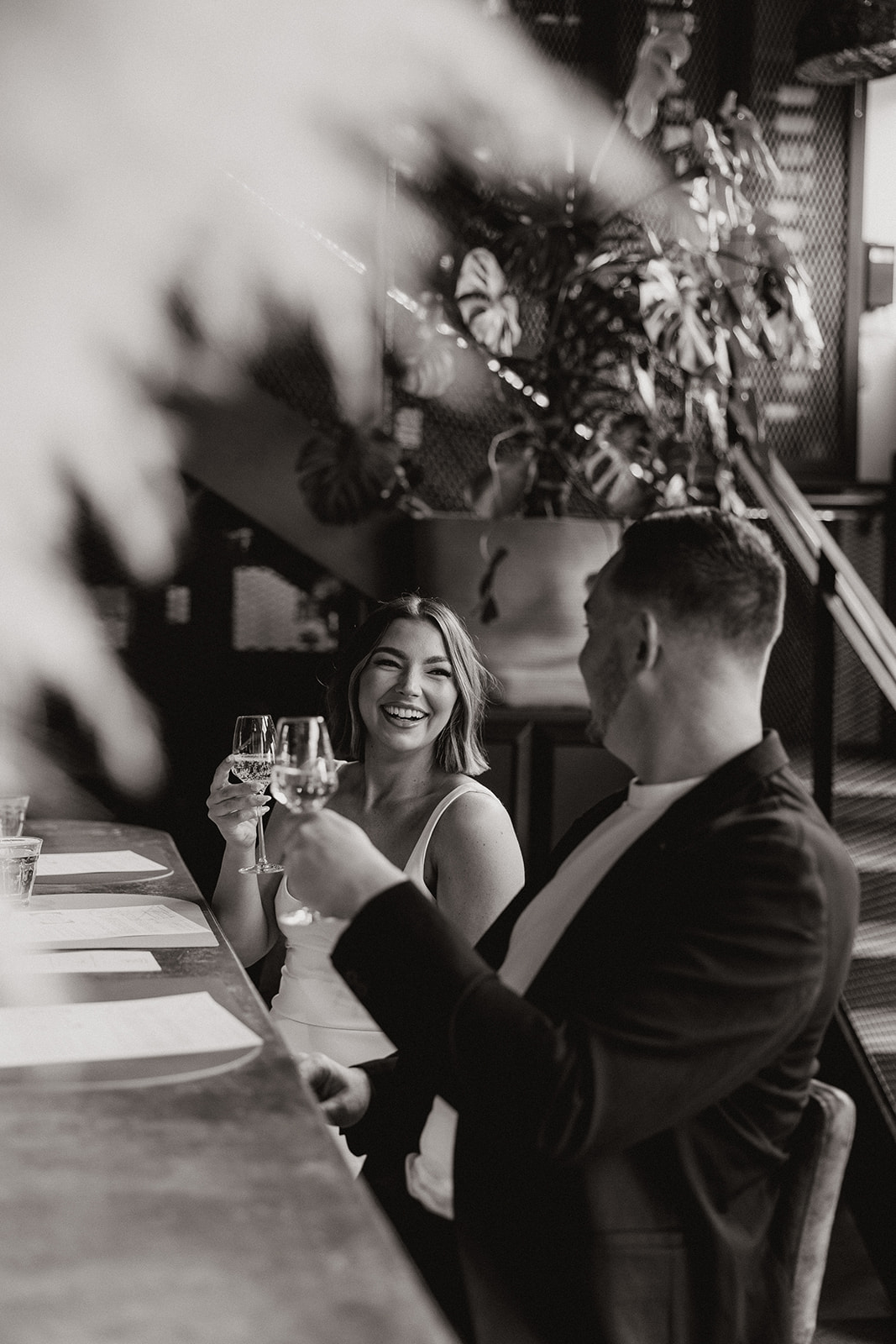 stunning couple share a candid laugh during their natural engagement photoshoot