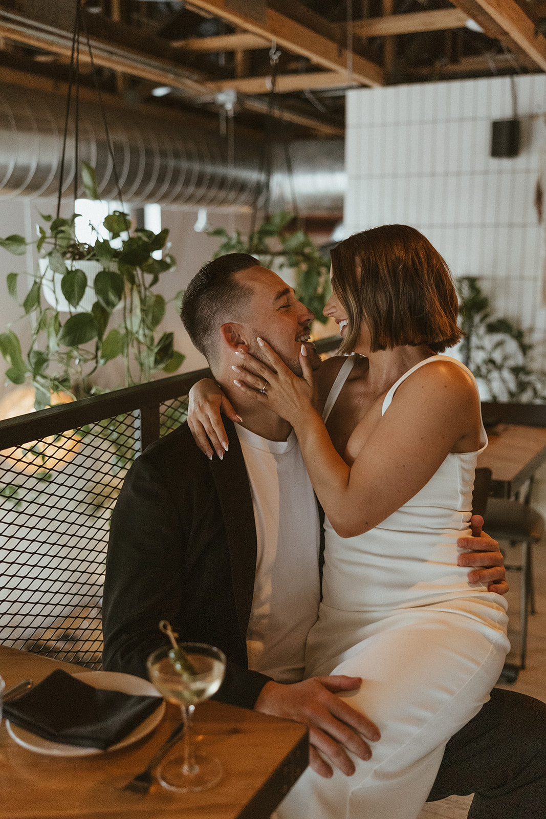 stunning couple share an intimate moment during their Arizona bar engagement photoshoot