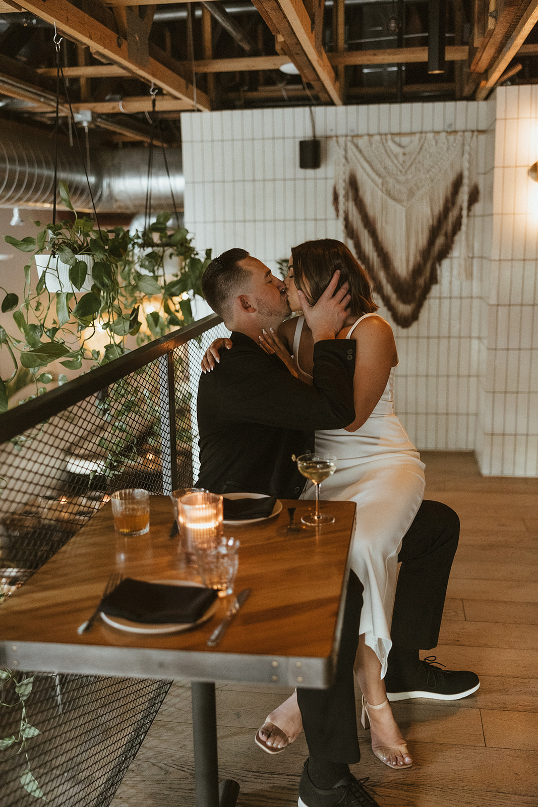 stunning couple share an intimate moment during their Arizona bar engagement photoshoot