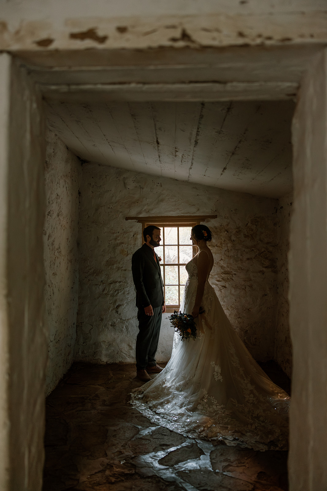 bride and groom pose together 