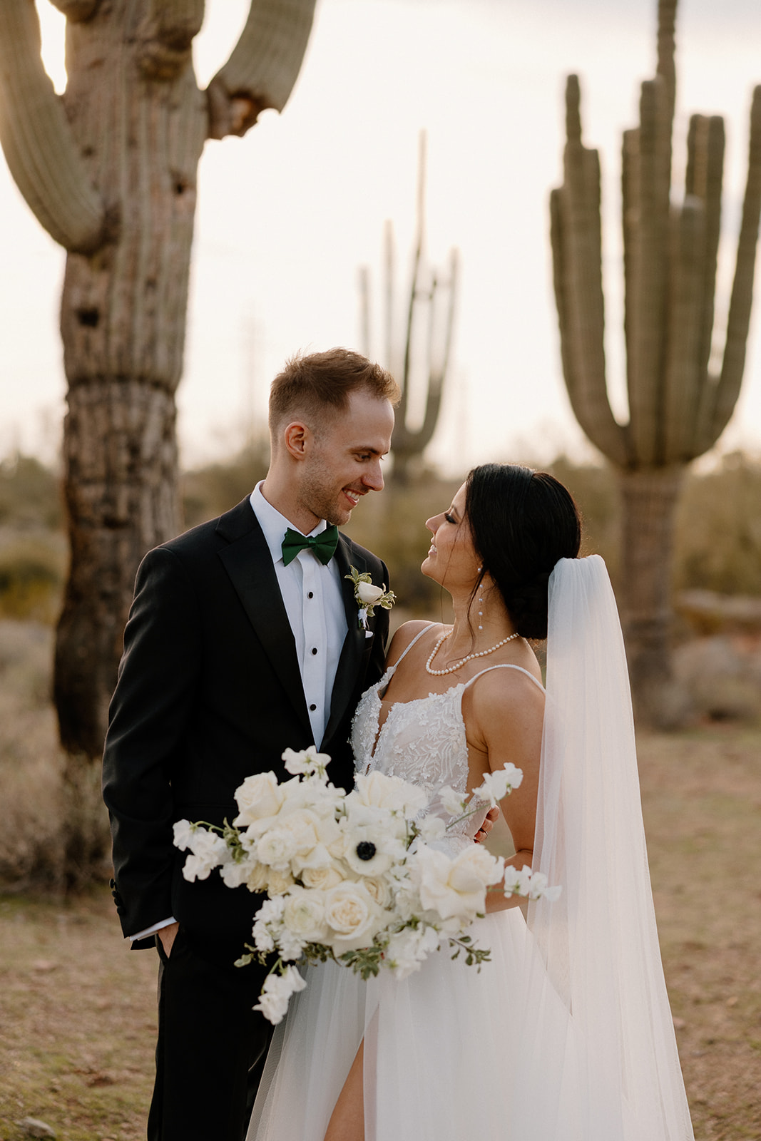 beautiful bride and groom take a moment during their busy wedding day timeline to take photos in the Arizona desert