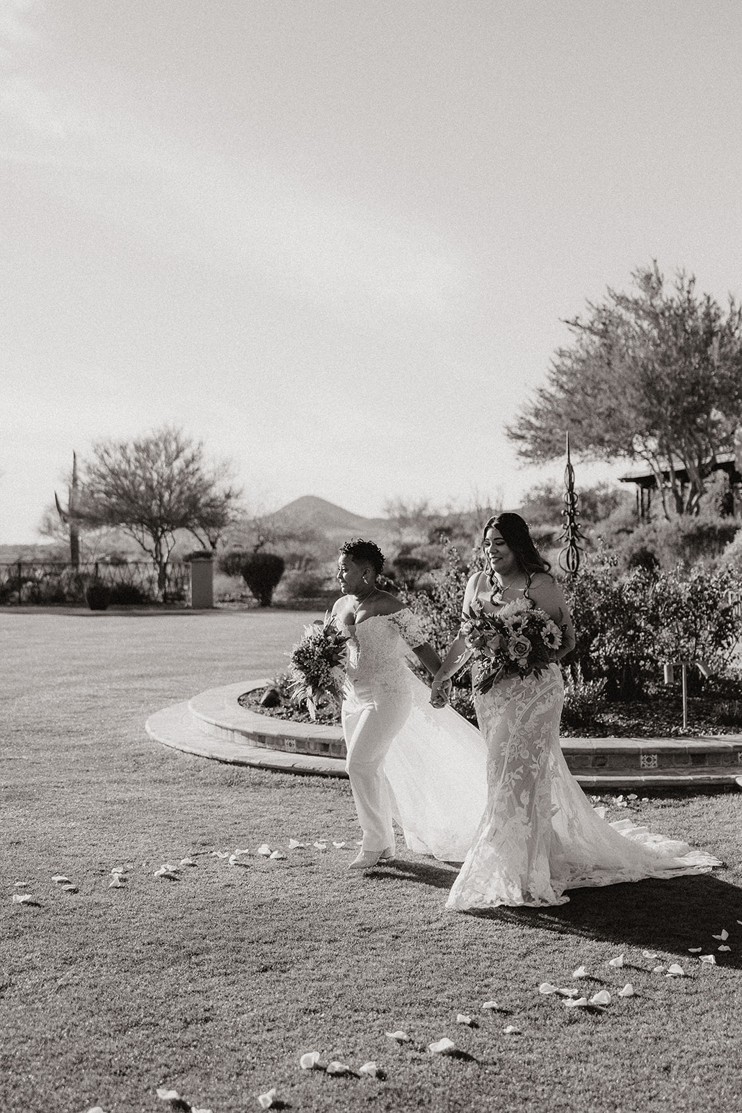 stunning brides pose together during their dreamy blackstone country club wedding