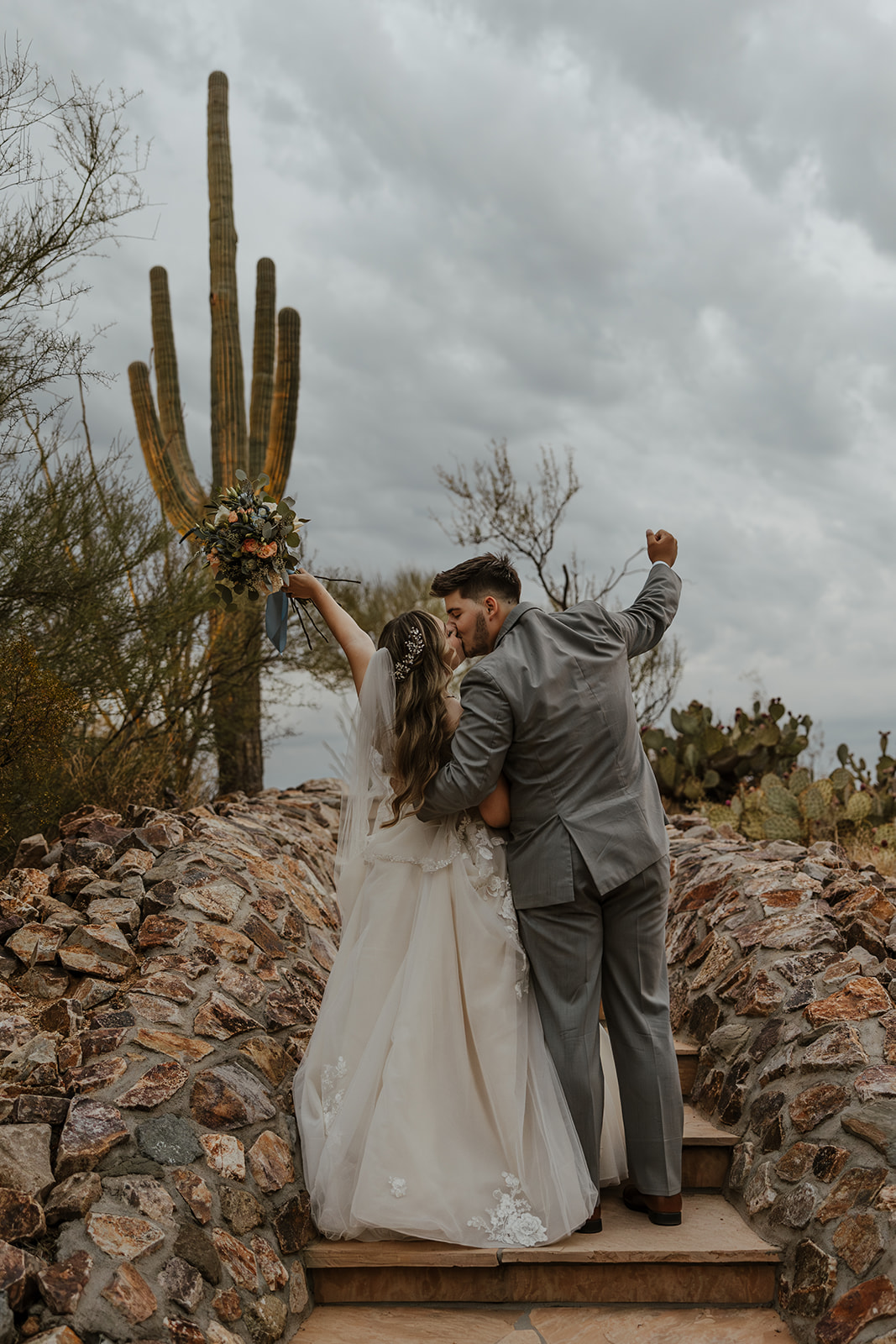 bride and groom share a kiss together after their Arizona wedding day