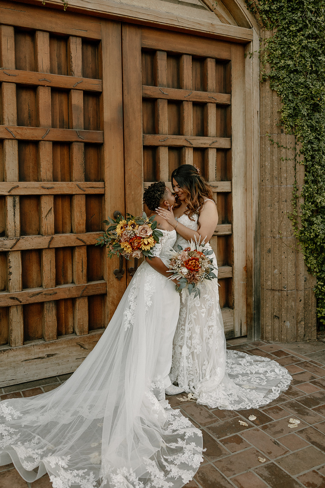 stunning brides pose together during their dreamy blackstone country club wedding