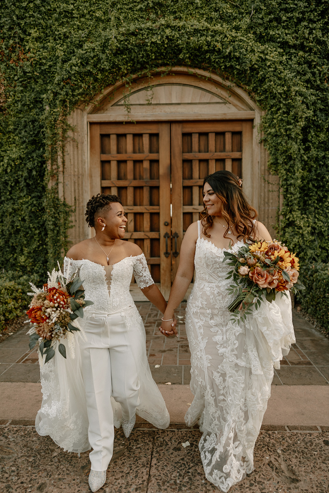 stunning brides pose together during their dreamy blackstone country club wedding