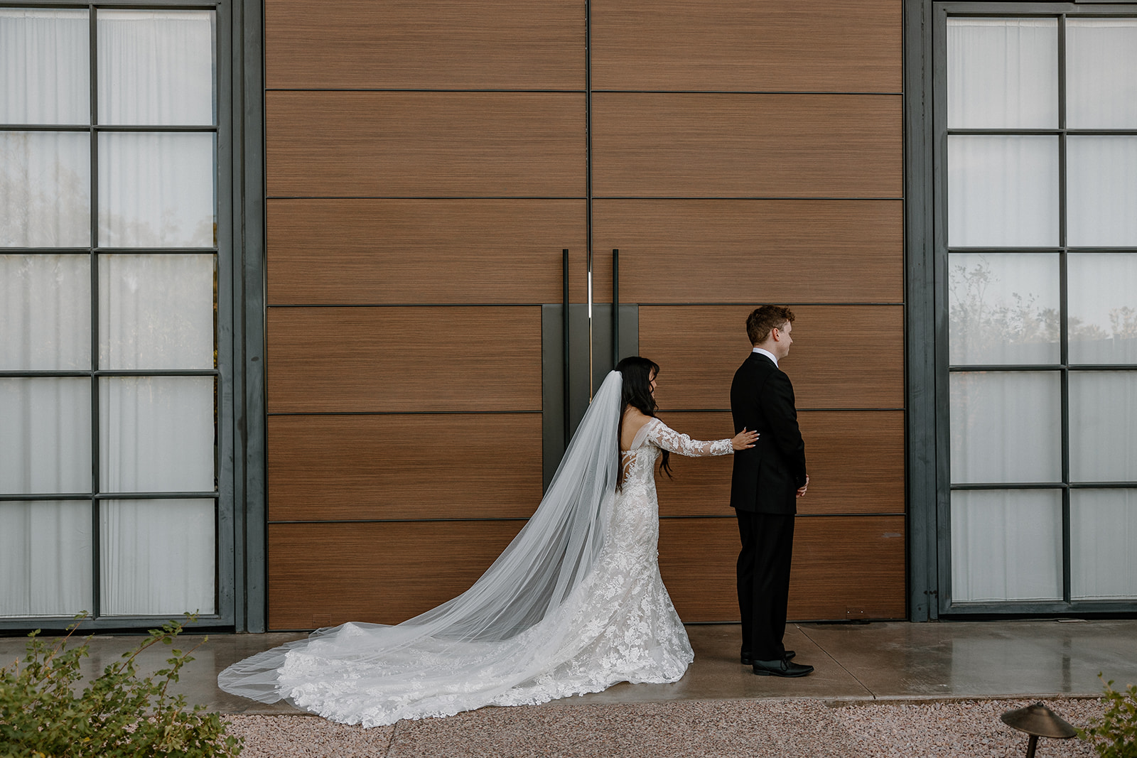 bride and groom start their wedding day timeline with first look photos