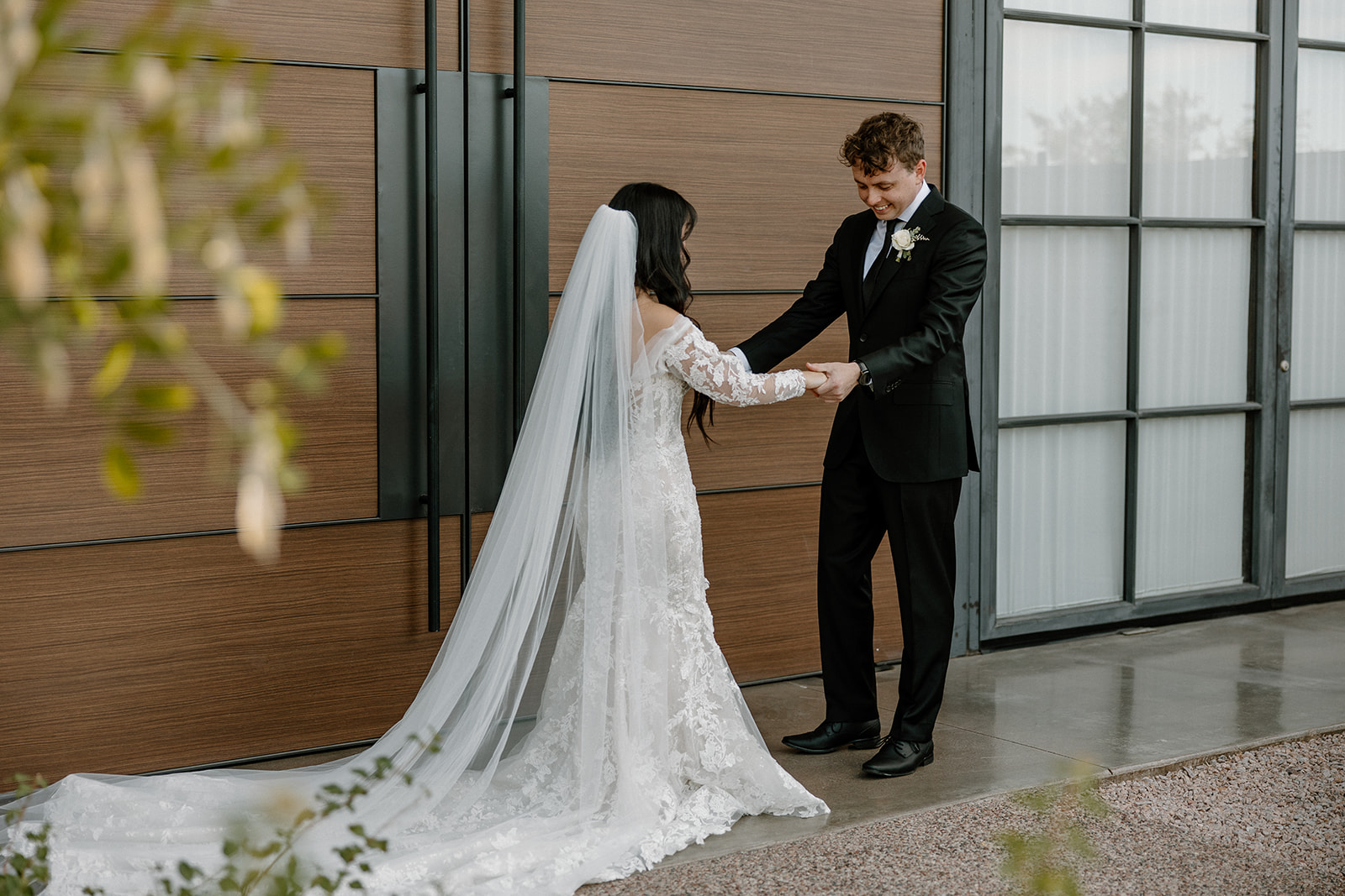 bride and groom start their wedding day timeline with first look photos