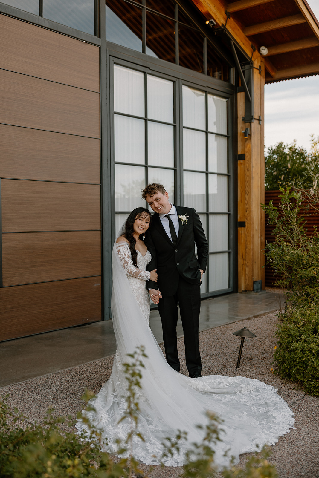 bride and groom start their wedding day timeline with first look photos