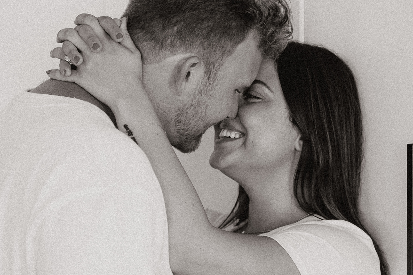 couple cooks together during their in home engagement photoshoot