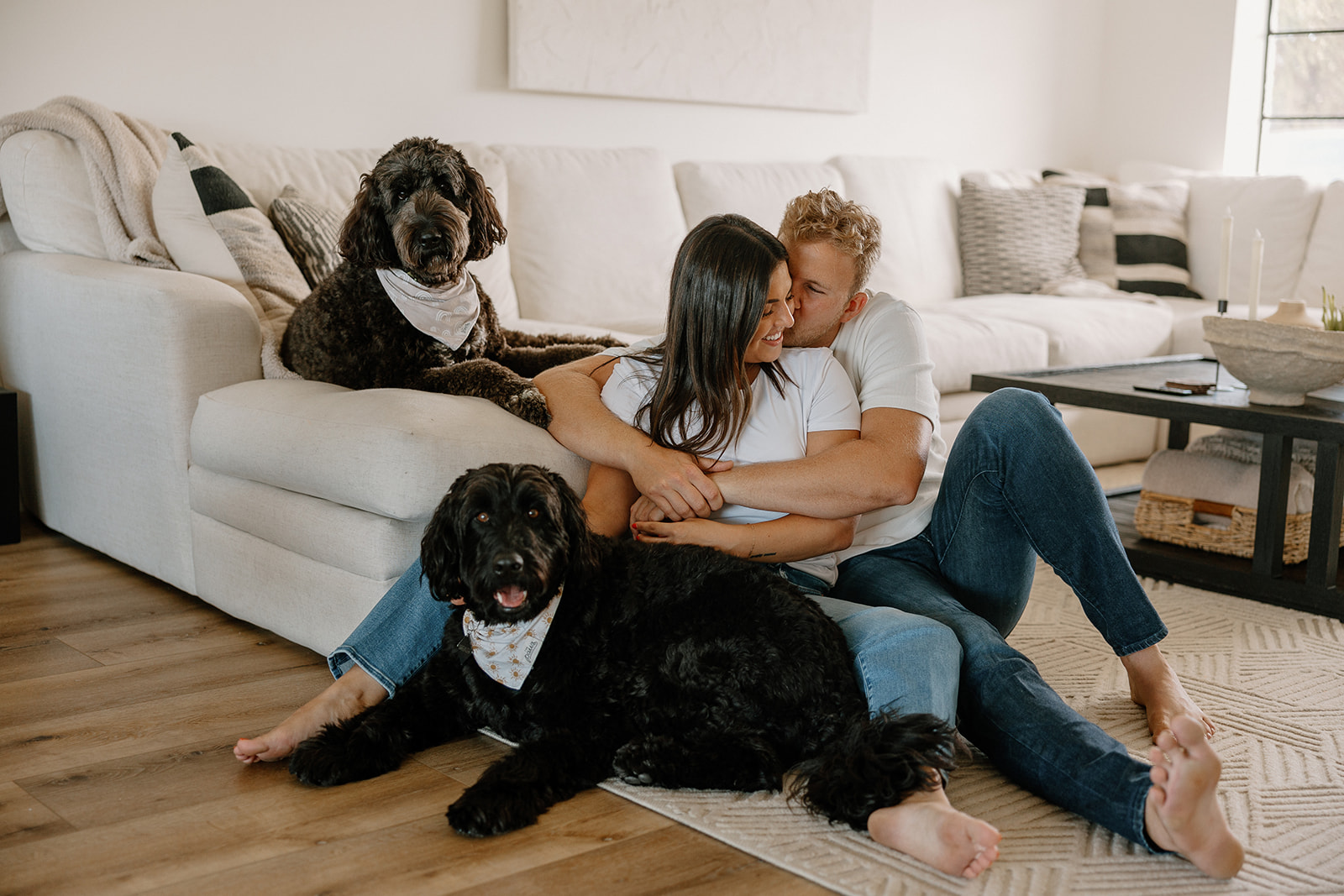 stunning couple share an candid moment together with their dogs