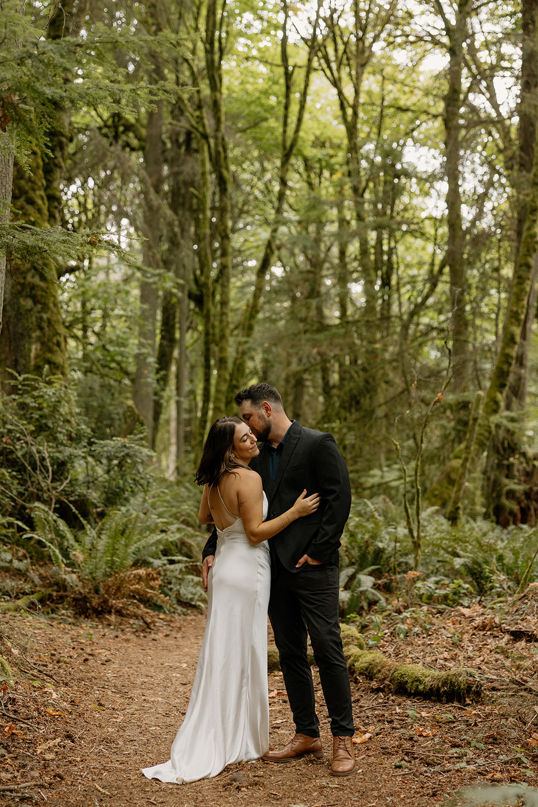 couple share an intimate moment during their PNW wedding anniversary